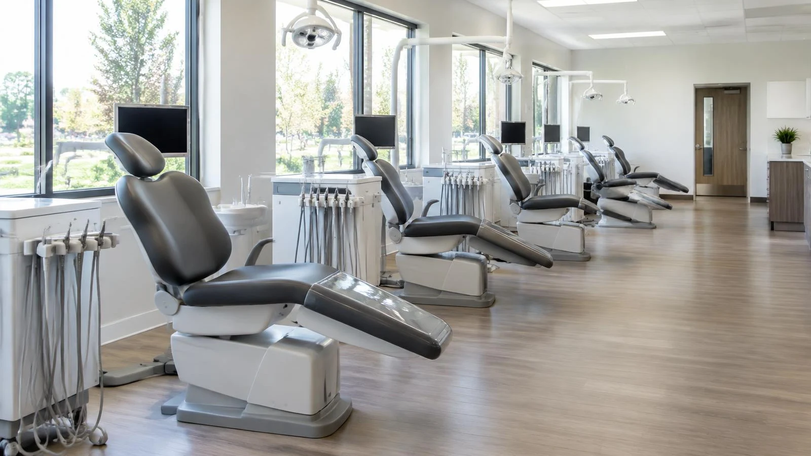 Orthodontic treatment bay with a row of patient chairs